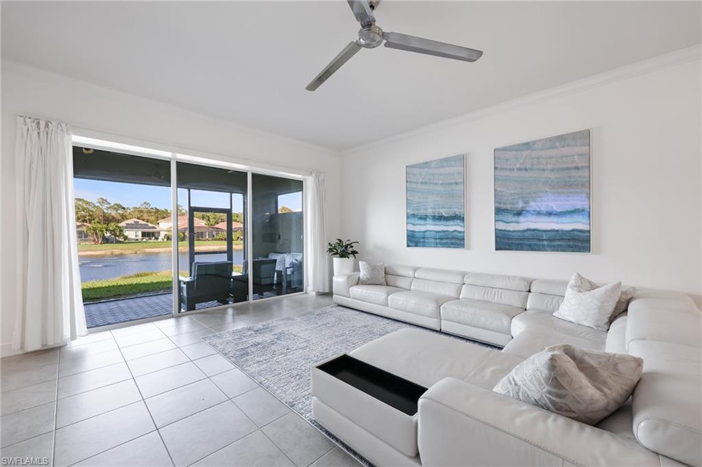 3275 Pilot Circle Naples, FL 34120 - Photo 13 of 44 a living room with furniture and a large window