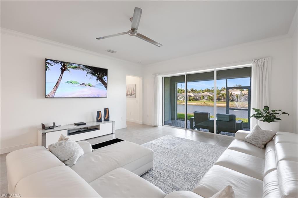 3275 Pilot Circle Naples, FL 34120 - Photo 15 of 44 a living room with furniture and a large window