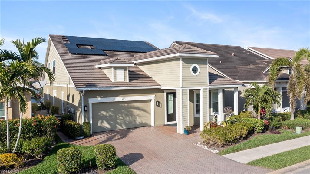 3275 Pilot Circle Naples, FL 34120 - Photo 2 of 44 a front view of a house with garden