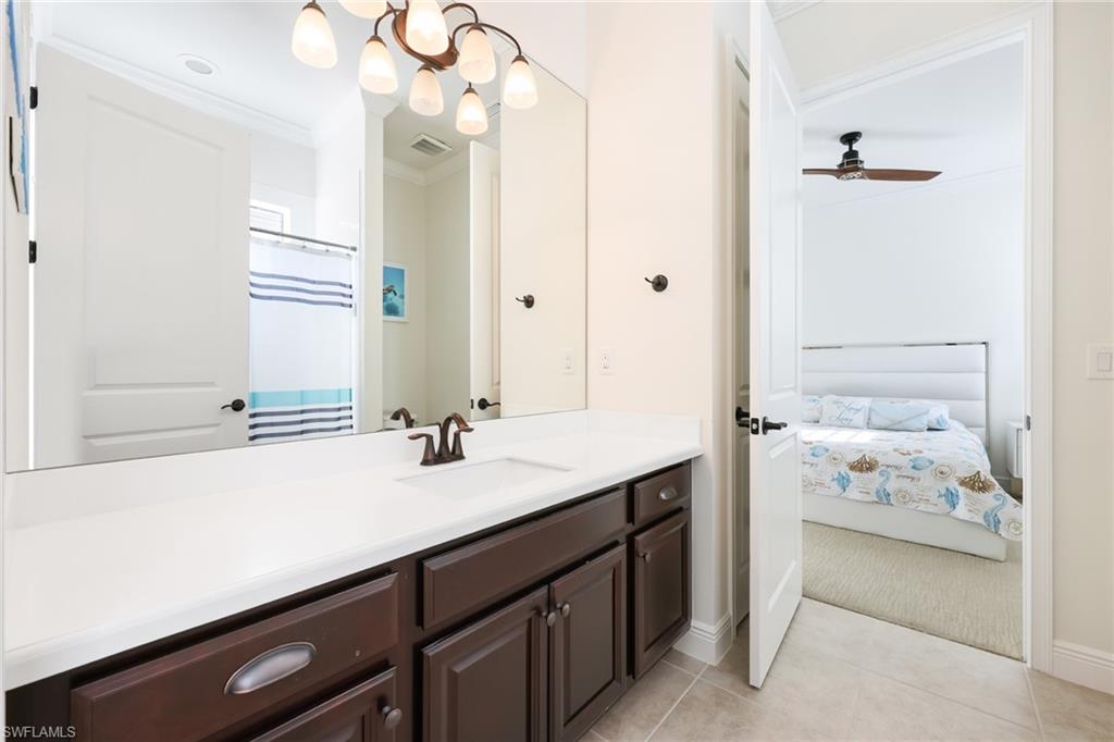 3275 Pilot Circle Naples, FL 34120 - Photo 26 of 44 a bathroom with a sink double vanity and a mirror