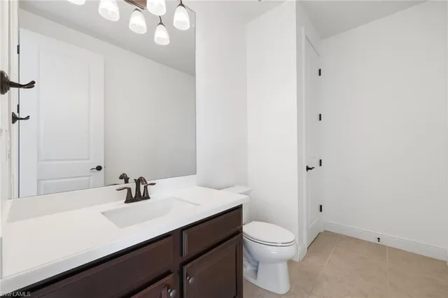 a bedroom with furniture and a large window