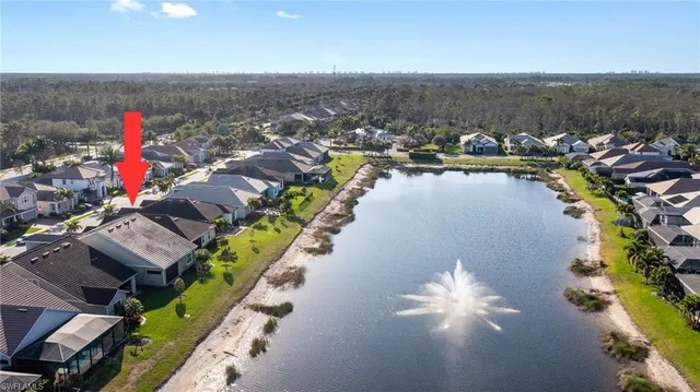 an aerial view of a houses with an outdoor seating