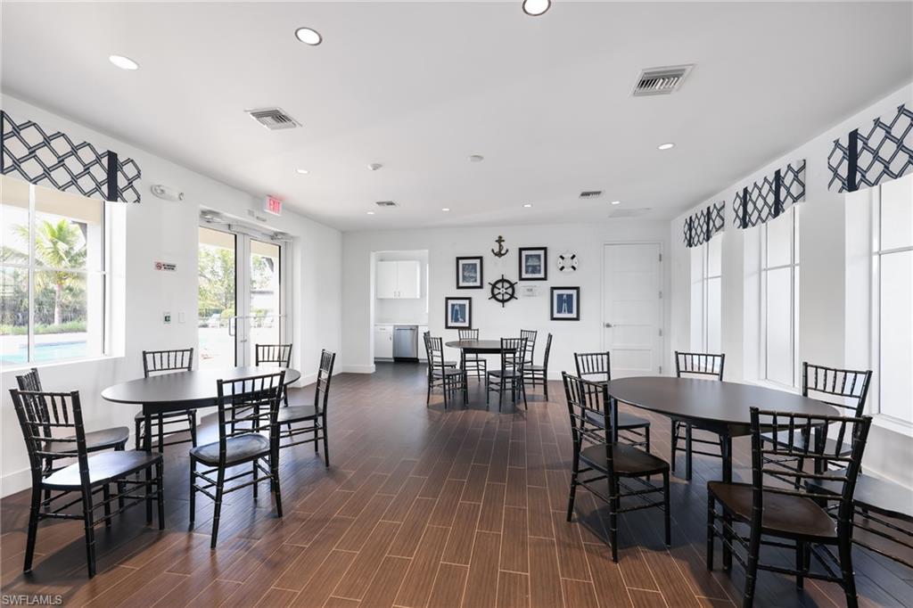 3275 Pilot Circle Naples, FL 34120 - Photo 40 of 44 a view of a dining room with furniture and wooden floor