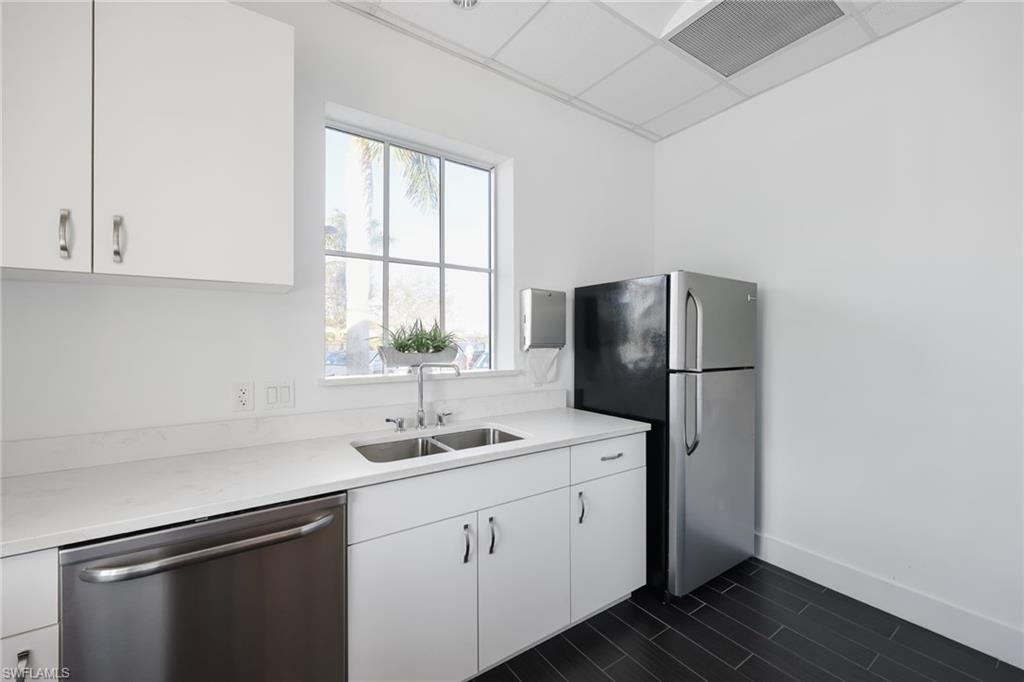 3275 Pilot Circle Naples, FL 34120 - Photo 41 of 44 a kitchen with a sink a refrigerator and window