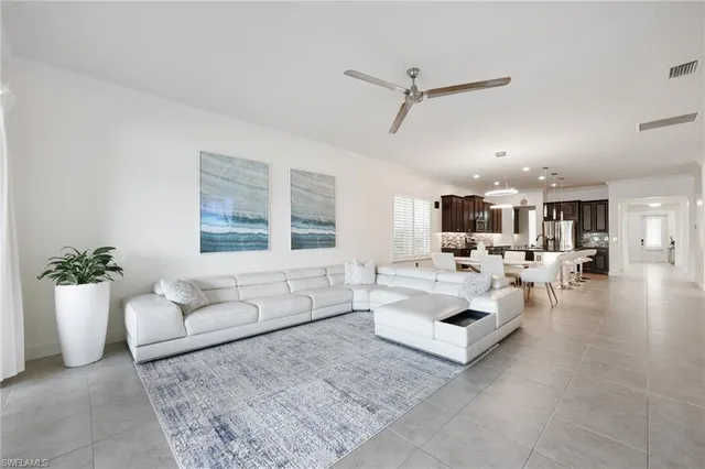 a living room with furniture and white walls