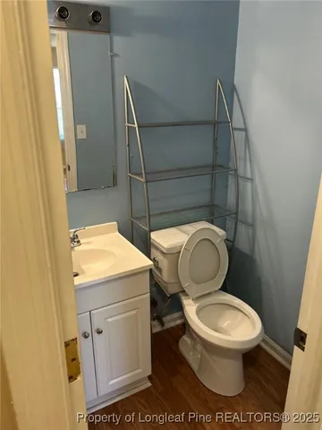a bathroom with a toilet and a sink