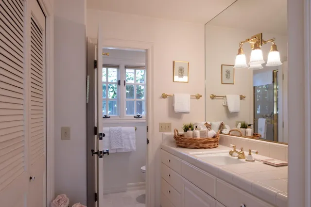 a bedroom with a bed and lamp