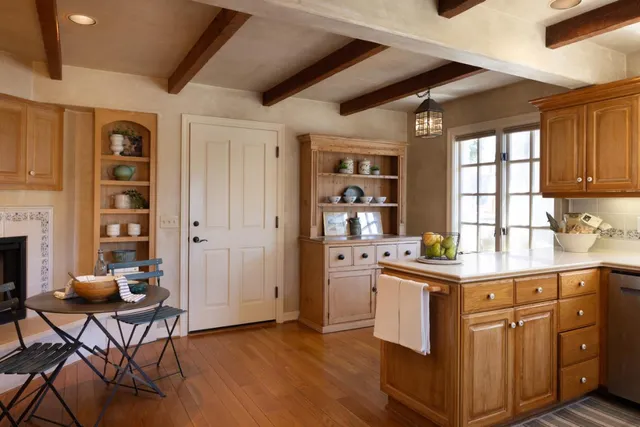 a kitchen with a stove and a fireplace