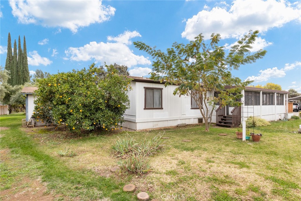 3835 Gardiner Ferry Road, Unit 4 Corning, CA 96021 - Photo 20 of 22 a view of a house with a tree in the background