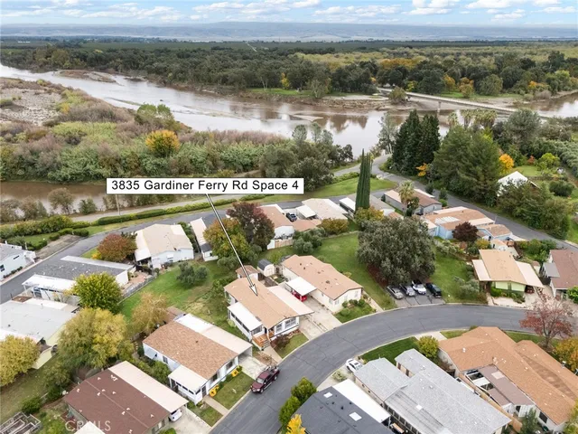 an aerial view of a house with a lake view