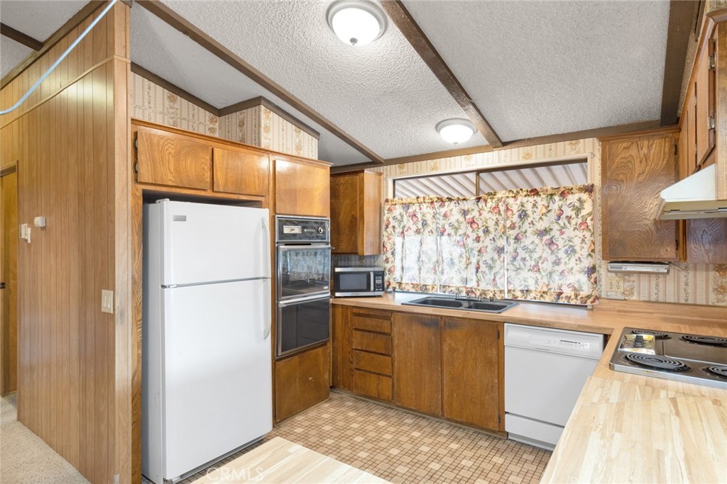 3835 Gardiner Ferry Road, Unit 4 Corning, CA 96021 - Photo 9 of 22 a kitchen with a sink appliances and cabinets