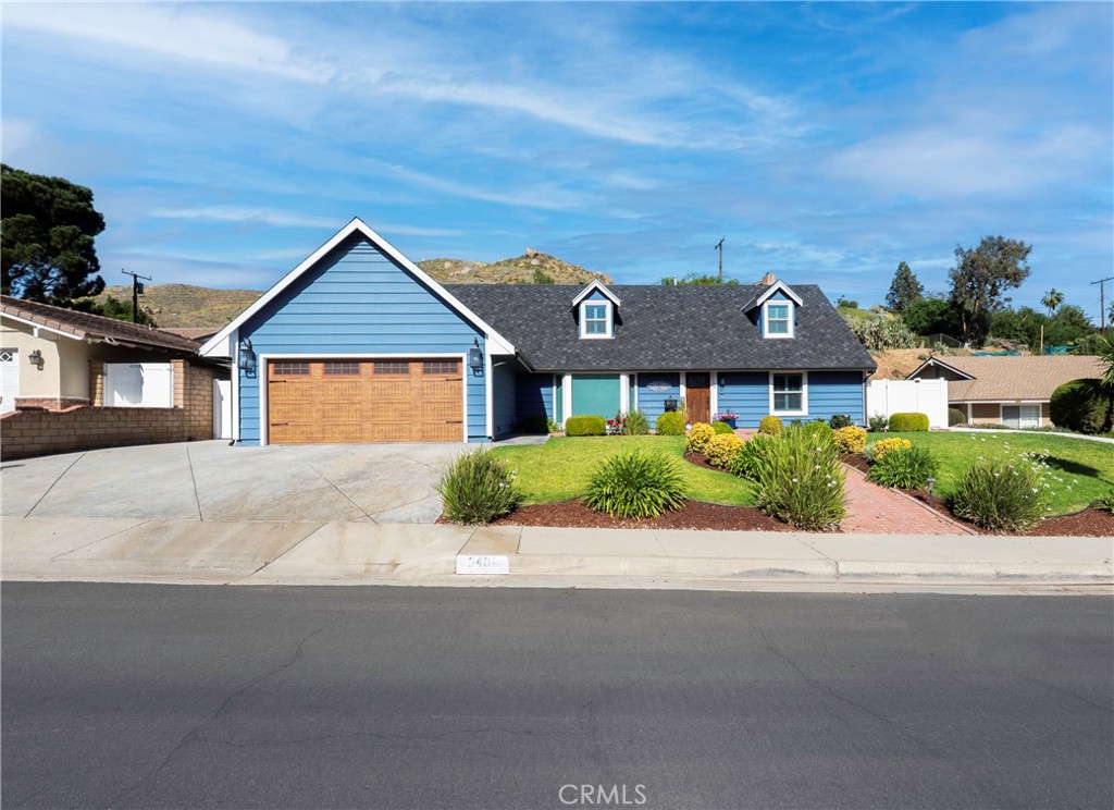 5481 Peacock Lane Riverside, CA 92505 - Photo 1 of 69 a front view of a house with a garden