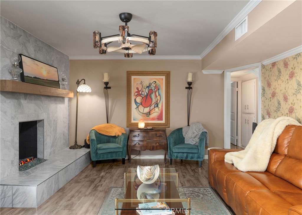 5481 Peacock Lane Riverside, CA 92505 - Photo 14 of 69 a living room with furniture a fireplace and wall paintings