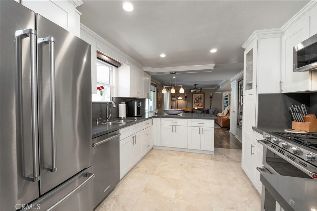 5481 Peacock Lane Riverside, CA 92505 - Photo 18 of 69 a kitchen with stainless steel appliances a refrigerator sink and microwave