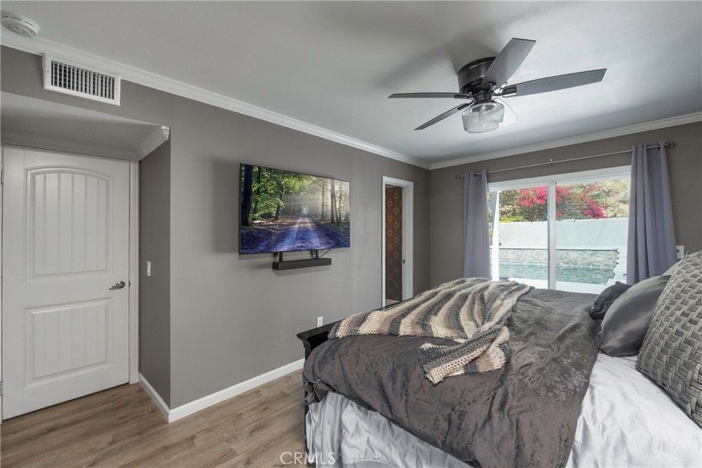 5481 Peacock Lane Riverside, CA 92505 - Photo 23 of 69 a bed sitting in a bedroom next to a window