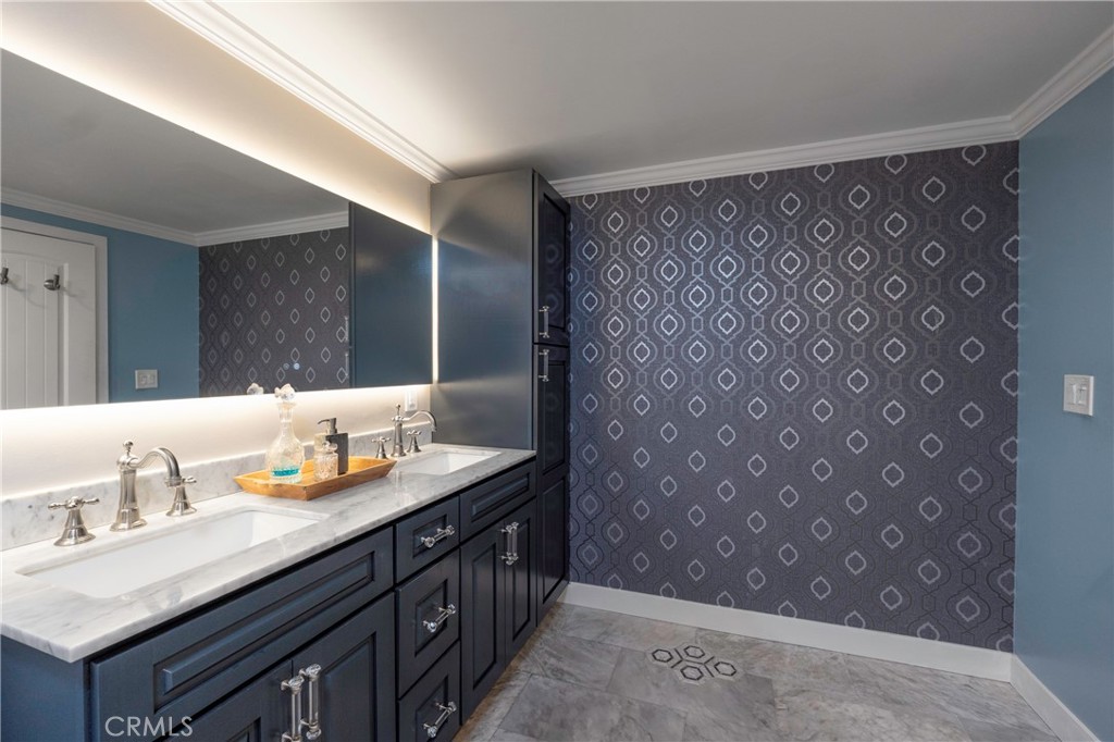 5481 Peacock Lane Riverside, CA 92505 - Photo 29 of 69 a bathroom with a double vanity sink and a mirror