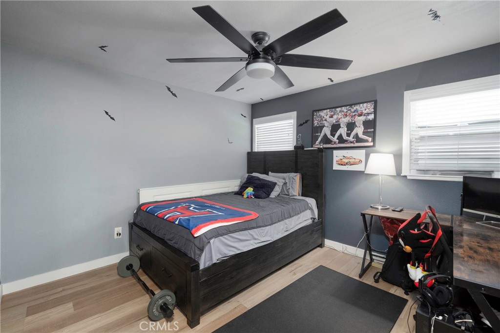 5481 Peacock Lane Riverside, CA 92505 - Photo 35 of 69 a bed room with a bed and a chair