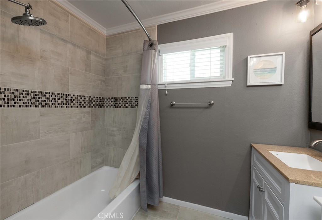 5481 Peacock Lane Riverside, CA 92505 - Photo 38 of 69 a bathroom with a bathtub a shower and a sink