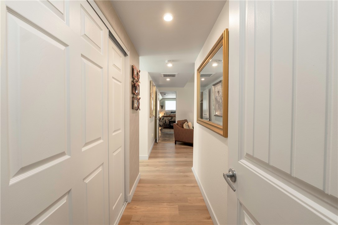 5481 Peacock Lane Riverside, CA 92505 - Photo 40 of 69 a view of a hallway view with wooden floor and staircase