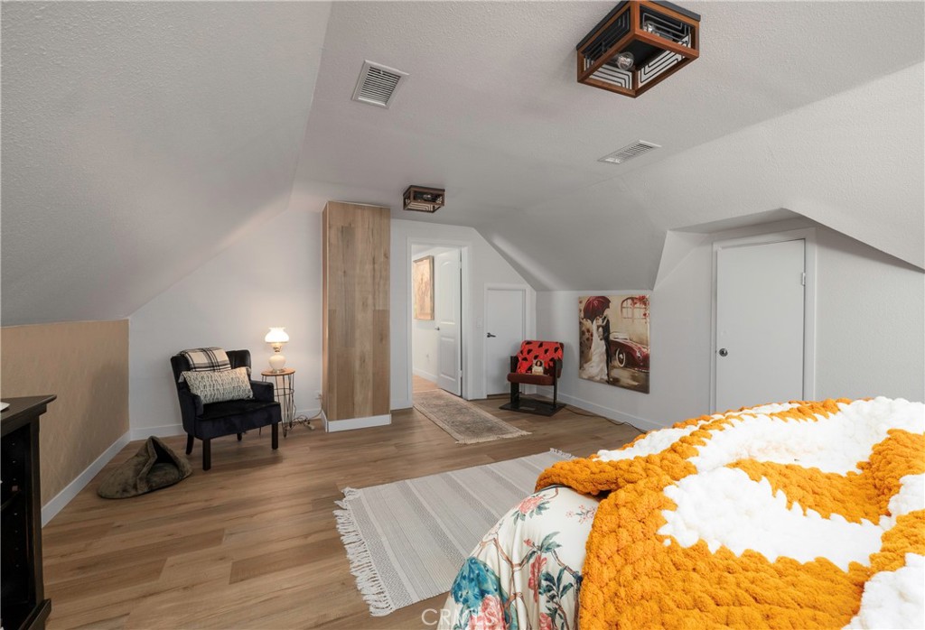 5481 Peacock Lane Riverside, CA 92505 - Photo 45 of 69 a bed room with a bed and a chair