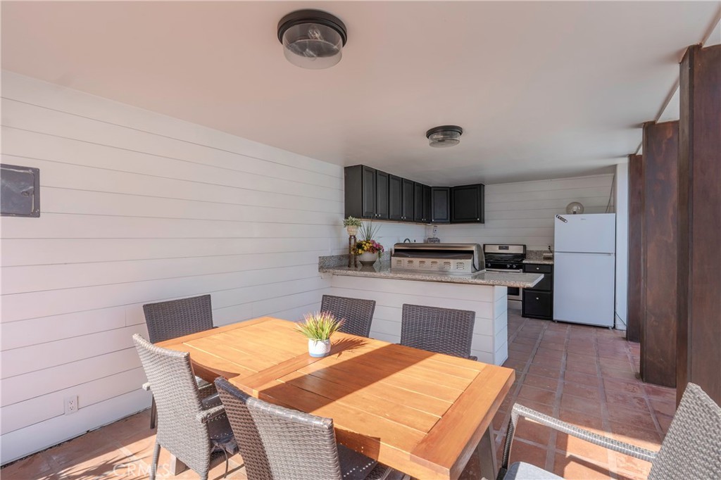 5481 Peacock Lane Riverside, CA 92505 - Photo 49 of 69 a kitchen with a table and chairs in it