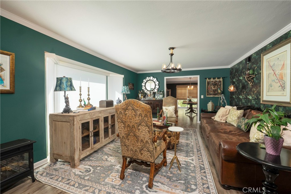 5481 Peacock Lane Riverside, CA 92505 - Photo 5 of 69 a living room with furniture and a chandelier
