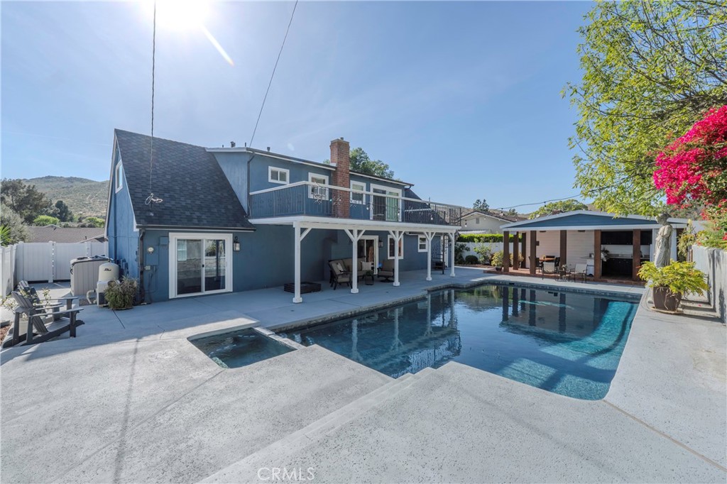 5481 Peacock Lane Riverside, CA 92505 - Photo 56 of 69 a view of a house with pool and sitting area