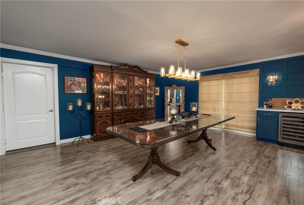 5481 Peacock Lane Riverside, CA 92505 - Photo 9 of 69 a living room with furniture a chandelier and wooden floor