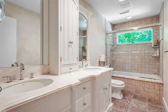 a spacious bedroom with a bed and window