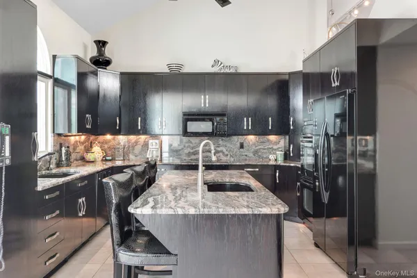 a kitchen with counter top space cabinets and stainless steel appliances