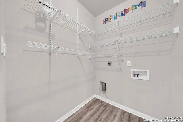 a view of a hallway with stairs