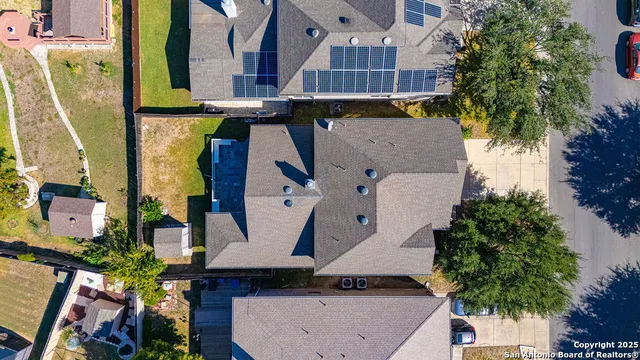 an aerial view of multiple houses with outdoor space