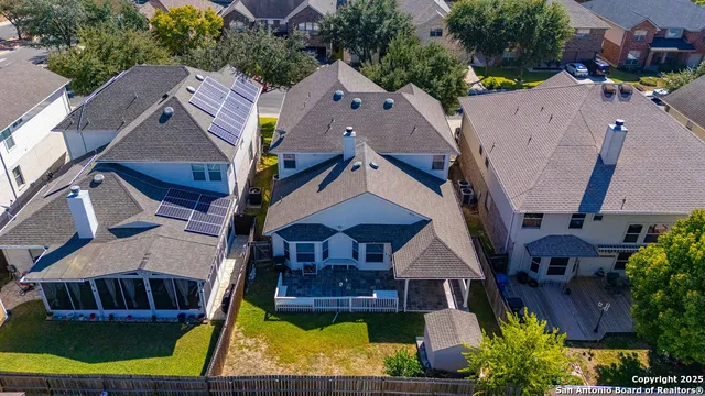 a aerial view of a house with a yard