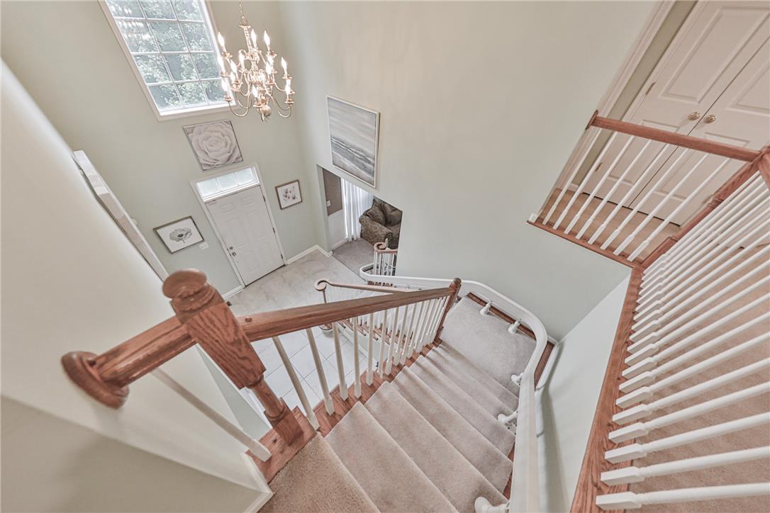 138 Clover Hollow Road Easton, PA 18045 - Photo 59 of 95 A grand, curved staircase with warm wood railings welcomes all who enter this home.