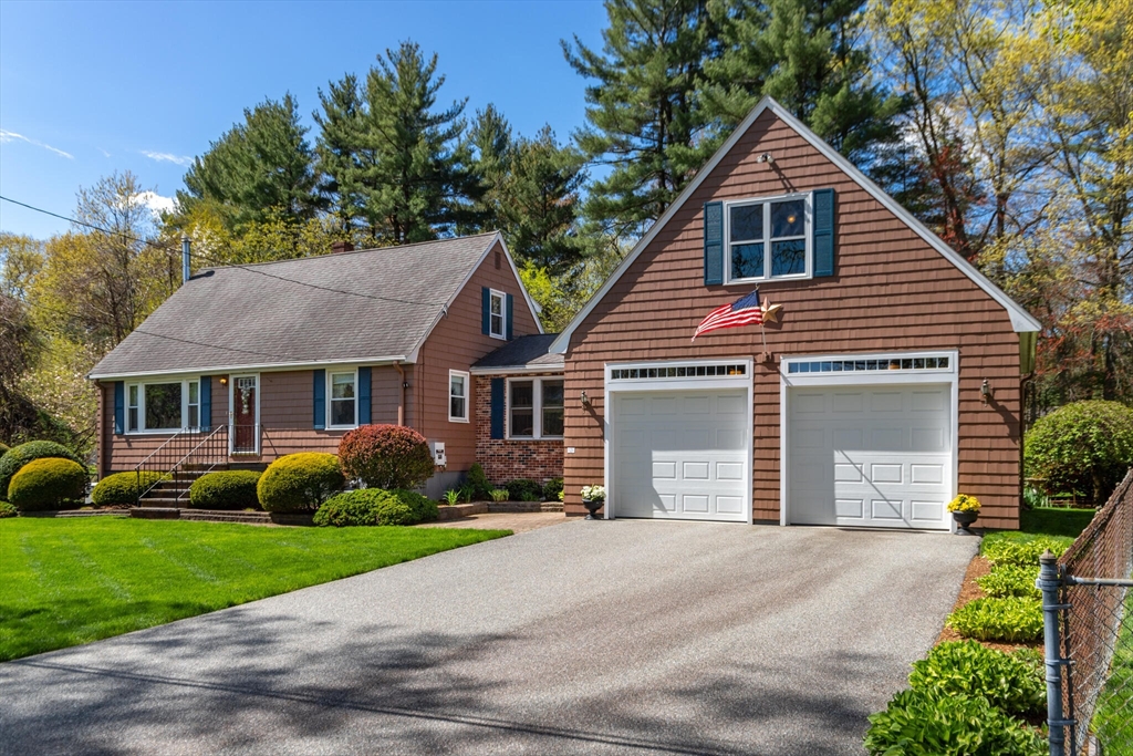 25 Bellflower Road Billerica, MA 01821 - Photo 1 of 40 a view of a yard in front of a house with plants and large tree