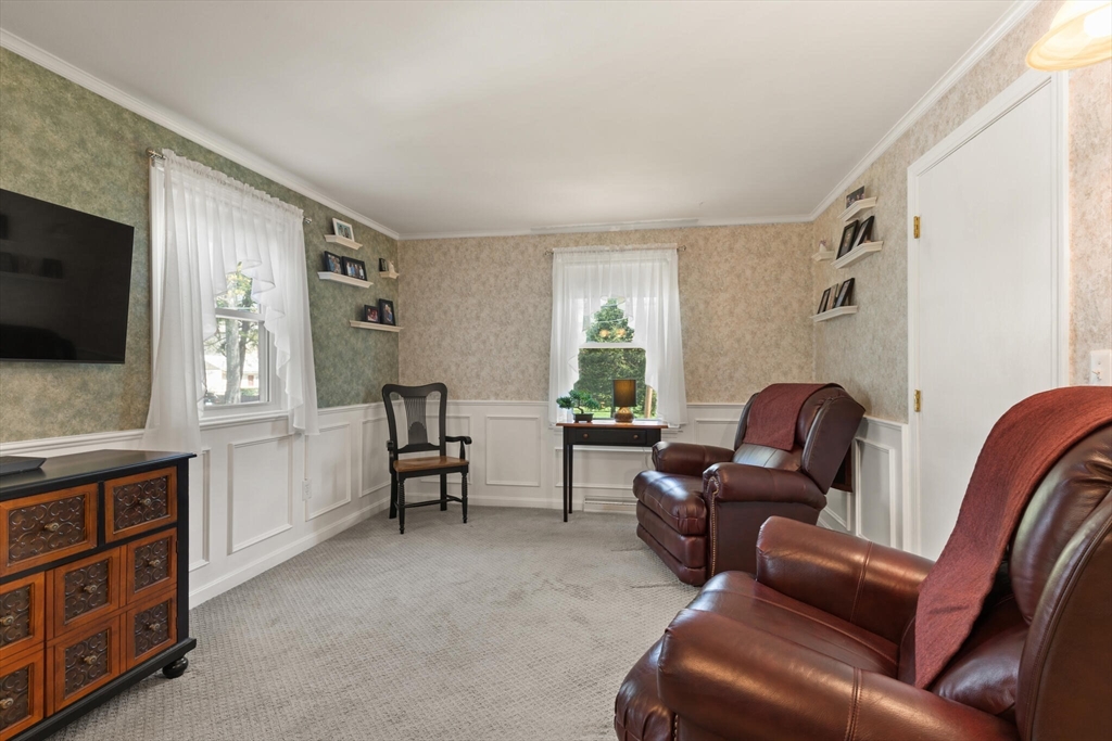 25 Bellflower Road Billerica, MA 01821 - Photo 18 of 40 a living room with furniture and a flat screen tv