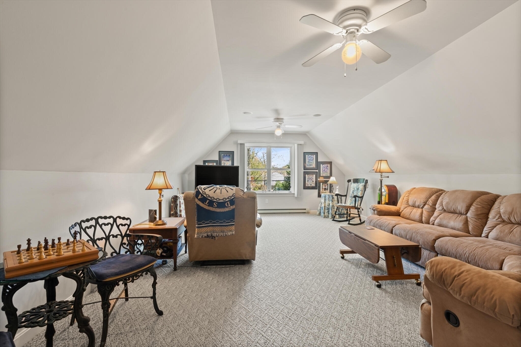 25 Bellflower Road Billerica, MA 01821 - Photo 24 of 40 a living room with furniture a ceiling fan and a rug