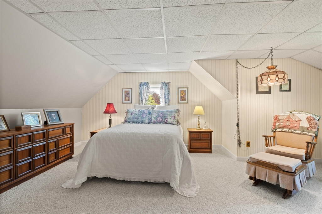 25 Bellflower Road Billerica, MA 01821 - Photo 26 of 40 a bedroom with a bed and a couch