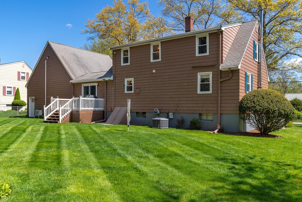 25 Bellflower Road Billerica, MA 01821 - Photo 32 of 40 a front view of a house with a yard
