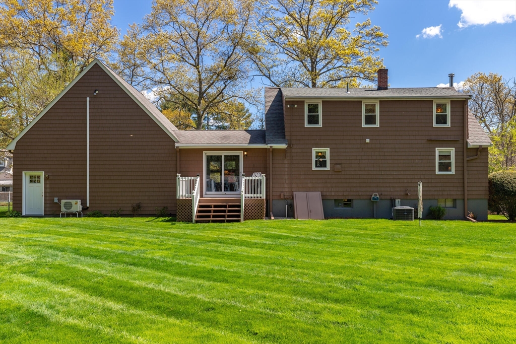 25 Bellflower Road Billerica, MA 01821 - Photo 34 of 40 a view of a house with a yard