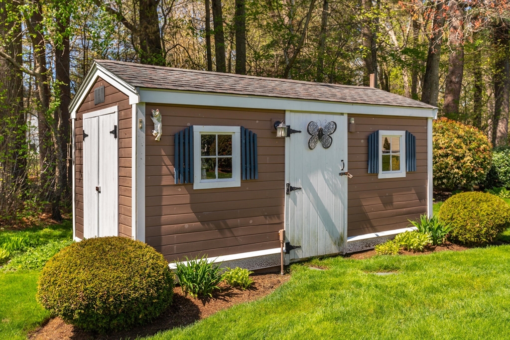 25 Bellflower Road Billerica, MA 01821 - Photo 35 of 40 a front view of a house with garden