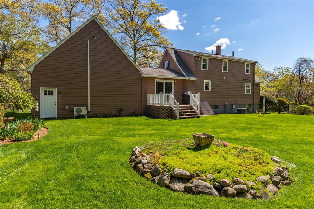 25 Bellflower Road Billerica, MA 01821 - Photo 36 of 40 a front view of a house with garden