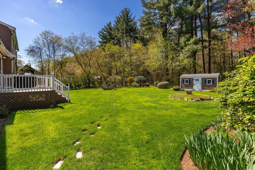 25 Bellflower Road Billerica, MA 01821 - Photo 37 of 40 a view of a house with a yard