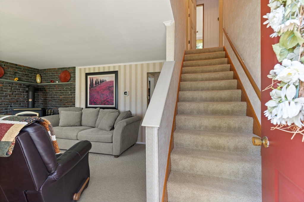 25 Bellflower Road Billerica, MA 01821 - Photo 6 of 40 a living room with furniture and a fireplace