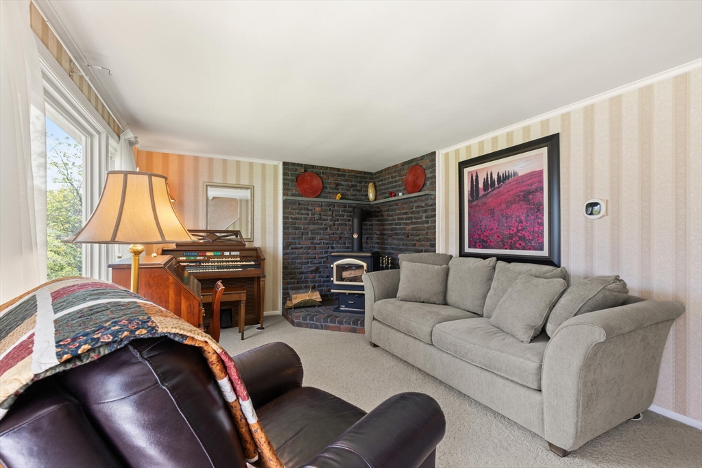 25 Bellflower Road Billerica, MA 01821 - Photo 7 of 40 a living room with furniture and a flat screen tv