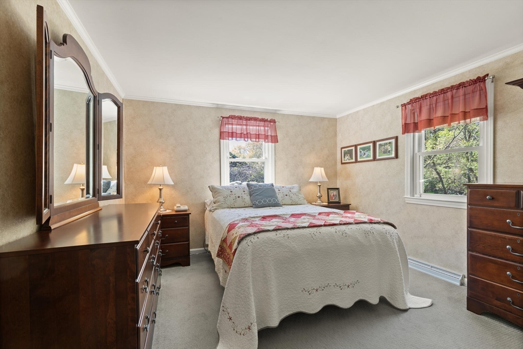 25 Bellflower Road Billerica, MA 01821 - Photo 10 of 40 a bed room with a bed window and a dresser