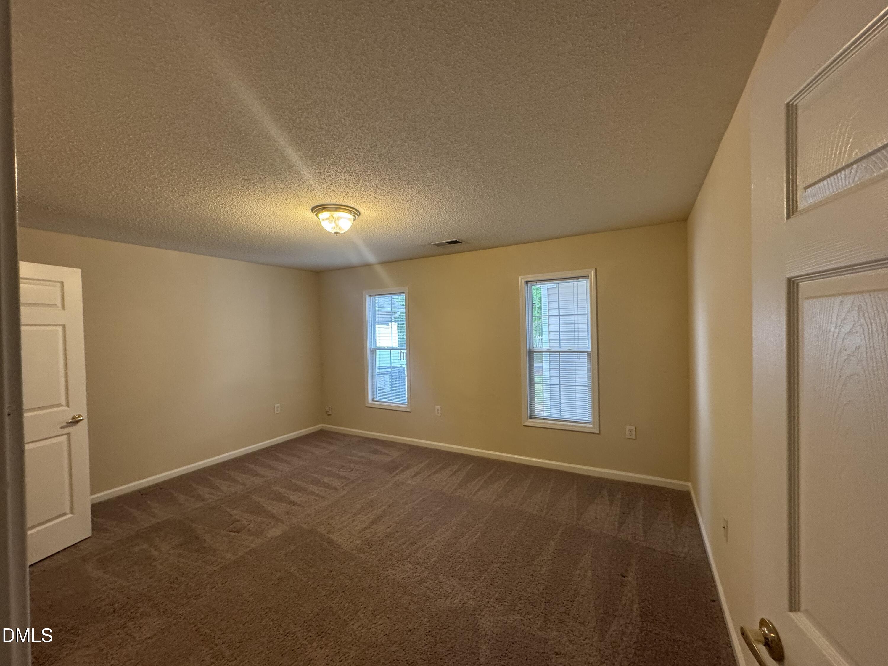 Undisclosed Address Raleigh, NC 27617 - Photo 17 of 22 a view of an empty room with a window