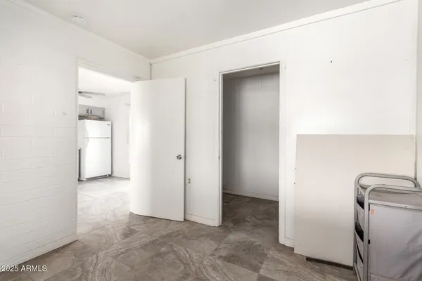 a view of a storage & utility room with a washer dryer