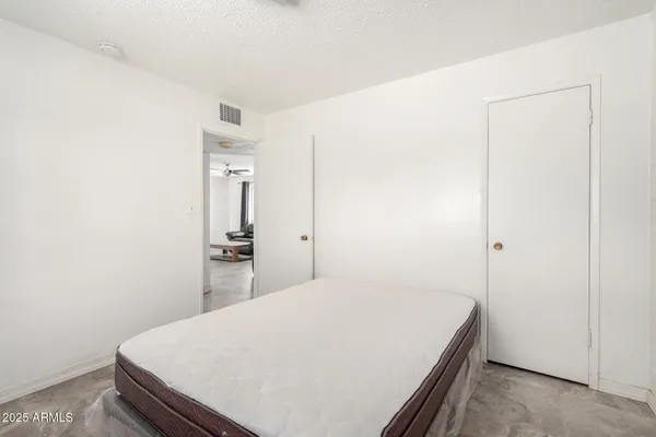 a room with a bed and a bathroom