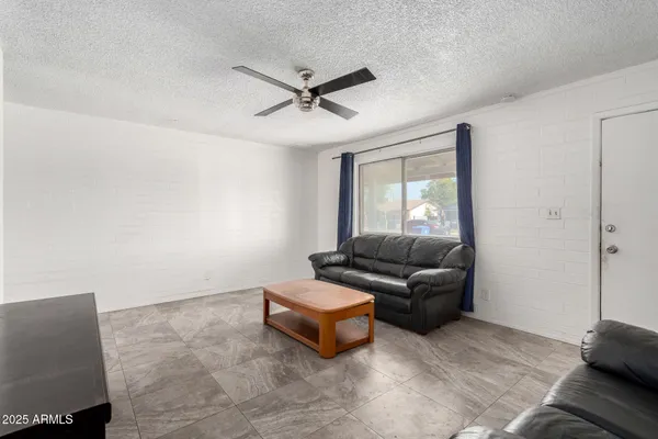 a living room with furniture and a window